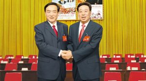 The former Party Secretary of Tibet Autonomous Region, Chen Quanguao (left) with the newly appointed Party Secretary Wu Yingjie (right).